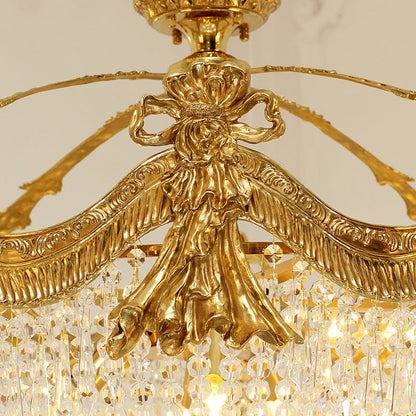 Detailed view of vintage ceiling lights showcasing golden brass bow and crystal beads.