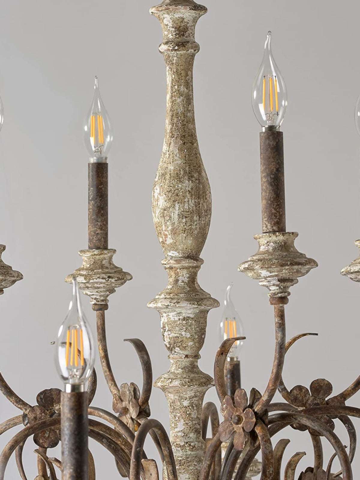 Amber glow from vintage-style bulbs on a French rustic ceiling fixture