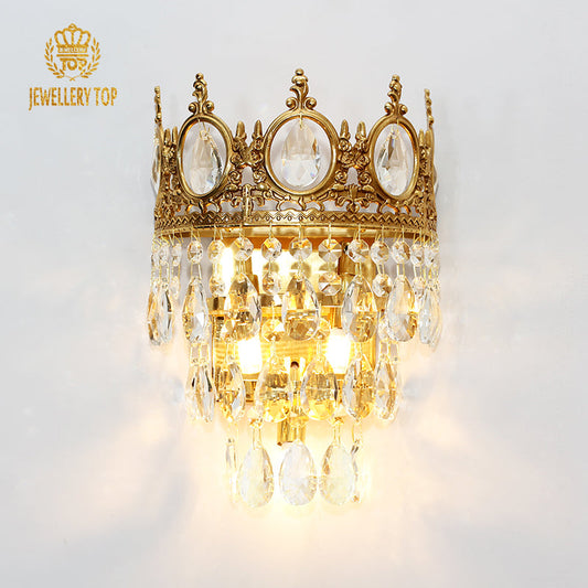 Frontal view of the Magnolia Crown Crystal Wall Sconce showing layered crystal drops