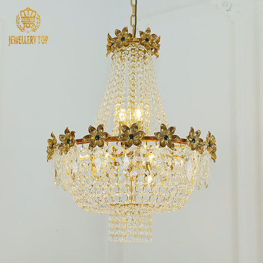 Ornate rococo chandelier with intricate brass and crystal detailing