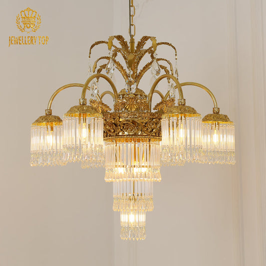 Ornate Victorian chandelier with brass arms and tropical palm motifs.