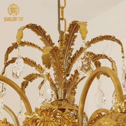 Delicate glass lantern shades suspended from palm-inspired brass detailing.