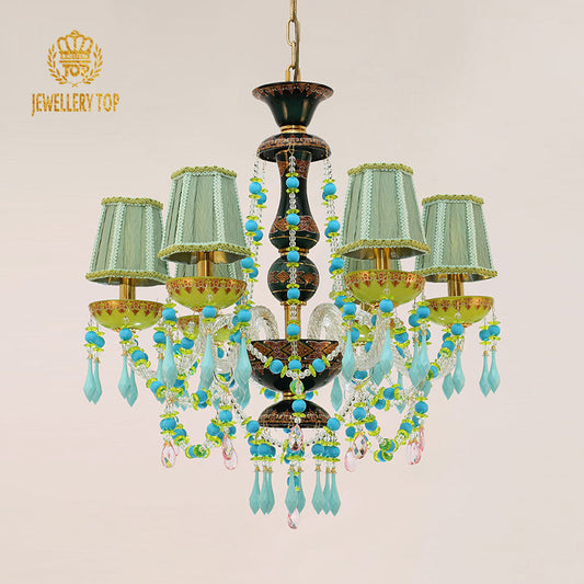 Colorful farmhouse chandelier featuring brass, glass, and fabric accents.