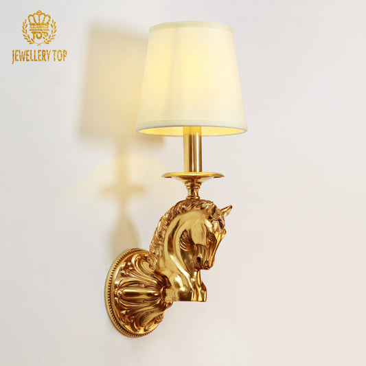 Frontal view of the Regal Stallion brass wall sconce featuring a horse head motif