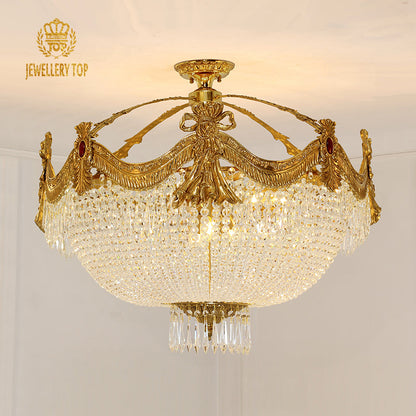 Renaissance-style vintage ceiling light with ornate brass garland frame and crystal detailing.