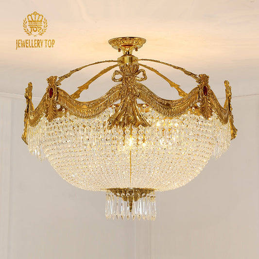 Renaissance-style vintage ceiling light with ornate brass garland frame and crystal detailing.