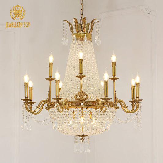 Brass crystal chandelier with cascading crystal strands and elegant curved arms.