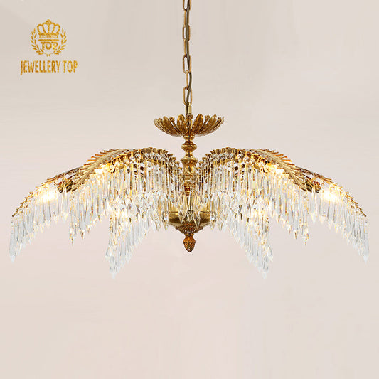 Elegant palm leaf chandelier with crystal pendants and a brass frame.